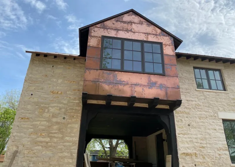 Copper metal panel facade on a stone building for Skylight Installation in East Pennsboro